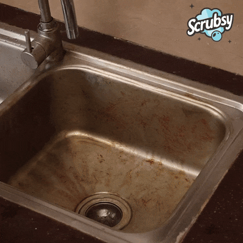Cleaning a kitchen sink with Scrubsy foam