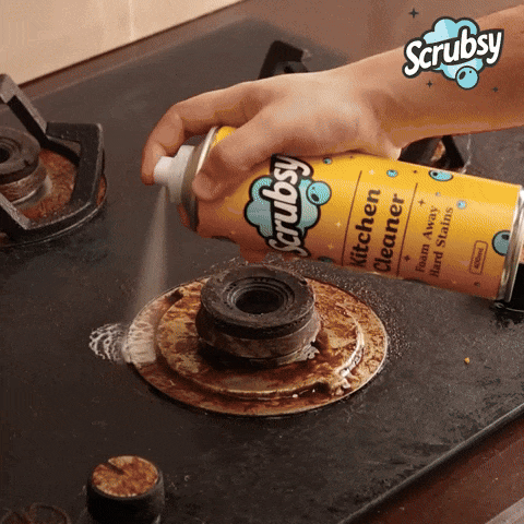 Cleaning a kitchen stove with Scrubsy foam