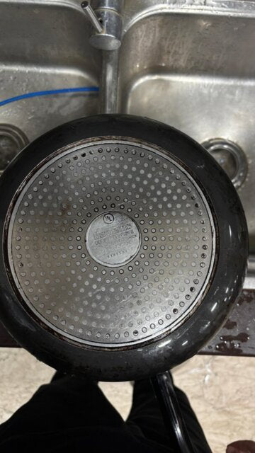 Customer photo of a pan cleaned in a kitchen sink
